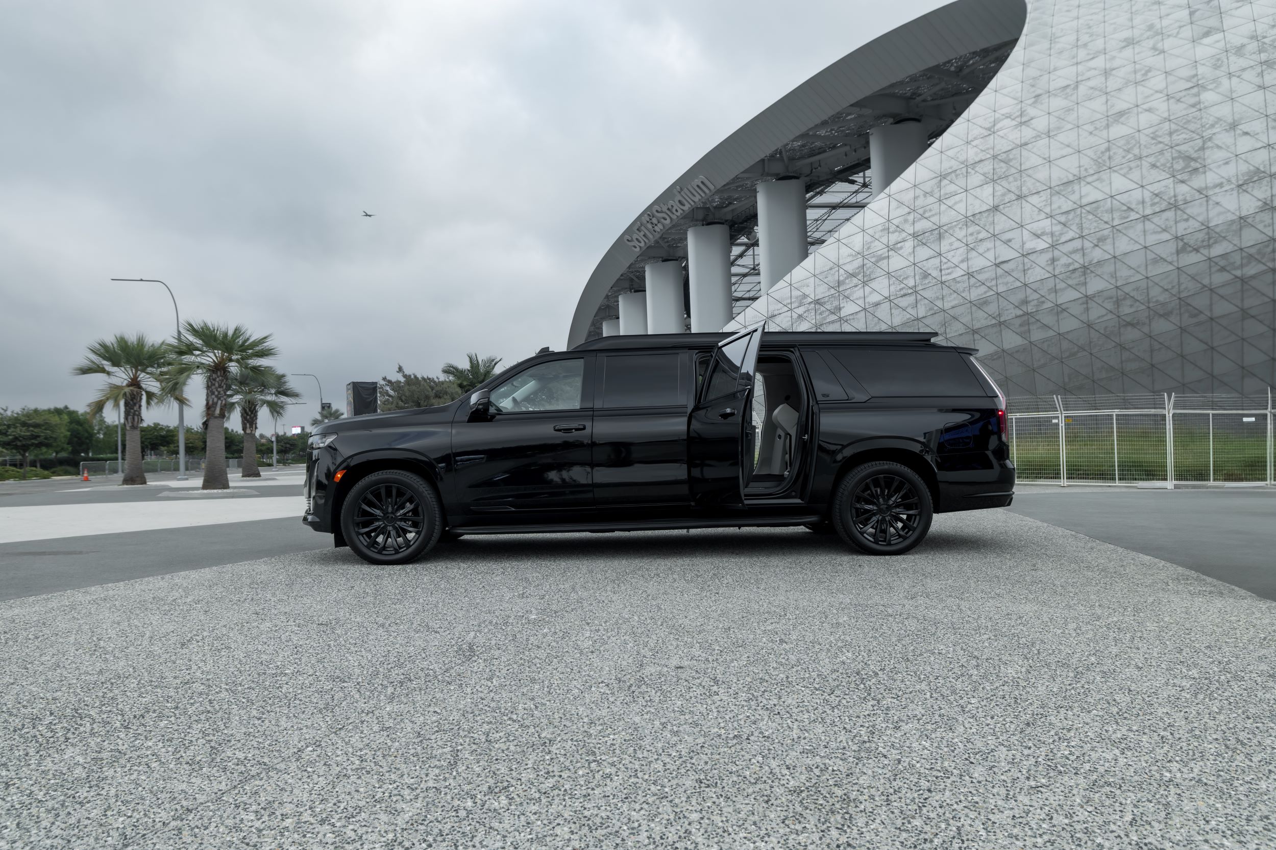Luxury executive vehicle arriving at a five-star villa entrance